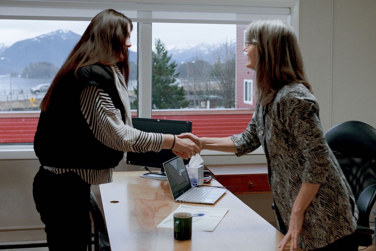 A financial advisor welcomes a client to a planning conversation